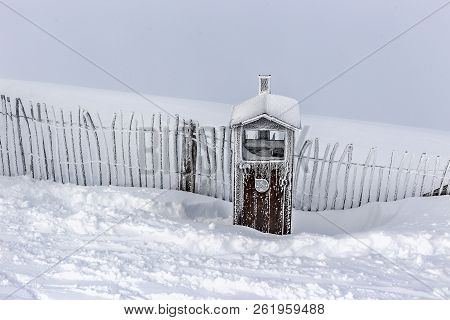 Hoarfrost In Frosty Day In Mountains. The Fence And A Wooden Box Are Covered With Hoarfrost, In The 