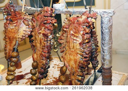 Many Cooking Traditional Turkish Roasting Lamb Barbecues.roasted Meat Over An Open Fire, Cooked In A