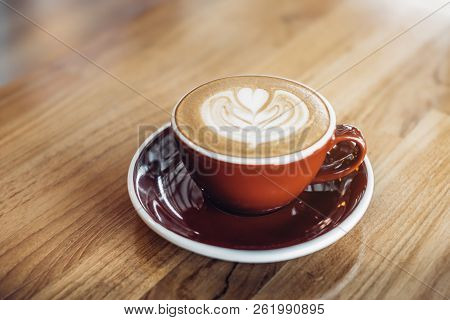 Close Up Hot Cappuccino Red Coffee Cup With Heart Shape Latte Art On Wood Table At Cafe,drak Tone Fi