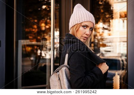 Portrait Female Student On Bright Background. Beautiful Modern Urban Young Woman Wearing Pink Knitti