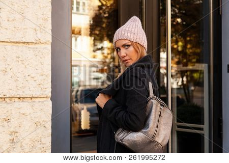 Portrait Female Student On Bright Background. Beautiful Modern Urban Young Woman Wearing Pink Knitti