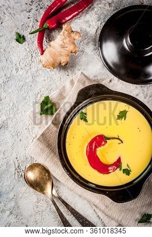 Traditional Indian Cuisine. Vegetarian Curry Gujarati Kadhi, Gujarati Daal Soup, With Spices On Grey