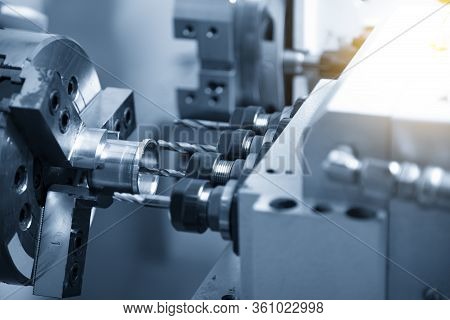 The  Multi-tasking Cnc Lathe Machine Swiss Type Tapping At The Brass  Shaft . The Hi-technology Meta