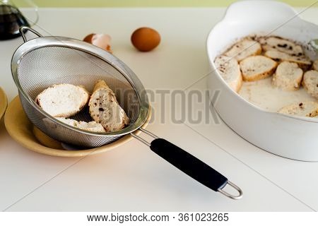Cooking Torrijas, A Typical Spanish Sweet Fried Toasts Of Sliced Bread Soaked In Eggs And Milk.