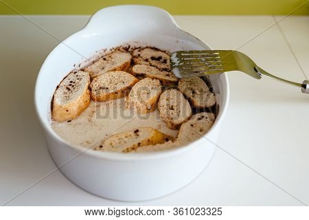 Cooking Torrijas, A Typical Spanish Sweet Fried Toasts Of Sliced Bread Soaked In Eggs And Milk.
