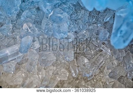 Druse of hyaline quartz illuminated by the light, creating color effects