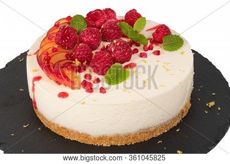 Cheesecake With Raspberriees, Plum And Mint Leaves Isolated On Ehite Background