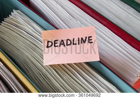 Deadline. Records Management. Thick Folders With Documents On Which A Sticker With Text Is Attached.