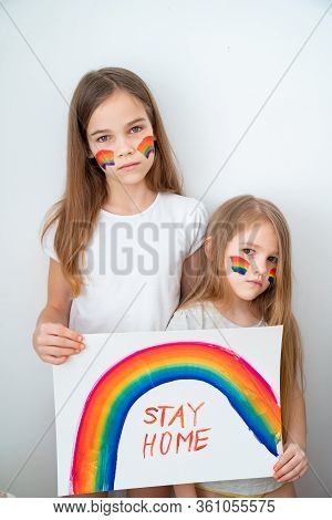 Two Kid Girls With Blond Hair Drew A Rainbow And A Poster Stay Home. Flashmob Chasetherainbow.
