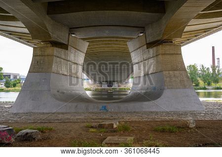 Prague - July 20, 2019: View Across The Vitava River Between The Legs Of The Troja Bridge