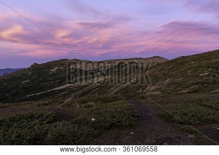 Unusual Red Evening Sky In The Mountains. Pink Sky In The Mountains.