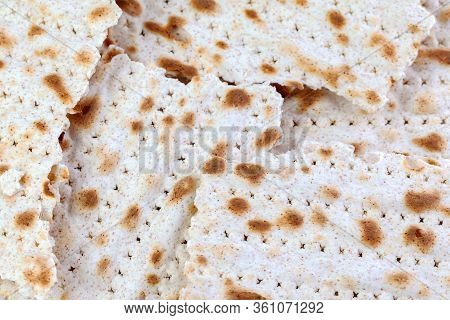 Matzah. Traditional Jewish Easter Bread. Passover Holiday Symbol. Broken Matzo, Lying In A Heap. Wit