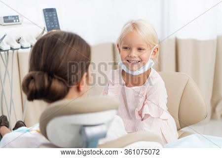 Young Patient Undergoing A Usual Check-up Procedure At The Denti