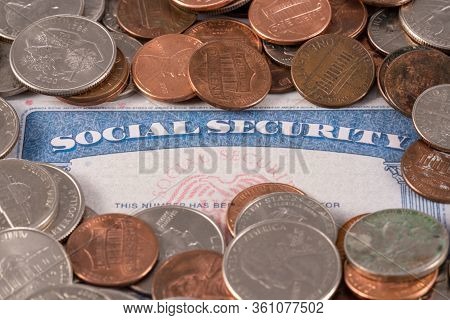 Usa Social Security Card With Coins And Cash To Show Funding Crisis In The Trust Fund