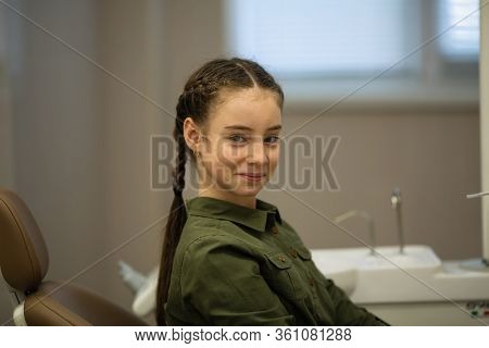 Portrait of teengirl in the dental office. Health care, stomatology and medicine.