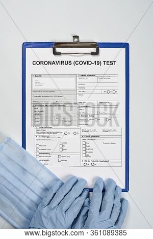 Hands Of Unrecognizable Doctor Or Nurse Filling Coronavirus Test Form. Get Covid-19 Test. Testing Fo