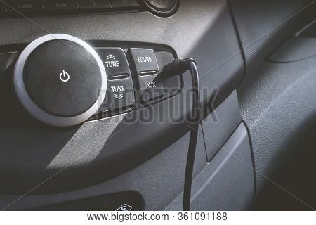 Car Audio System Front Panel. Car Dashboard. Vehicle Radio Console. Aux Input With A Audio Cable