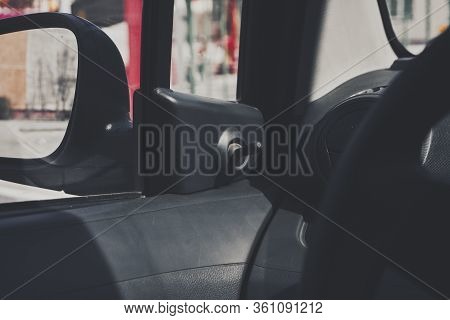 Manual Controller Of Car Side Mirrors. Side Mirror Controlling Switch In The Budget Automobile