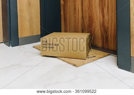 Box Delivered Via Contactless Delivery On Doormat In Front Of Front Door, Parcel Ordered Online Duri
