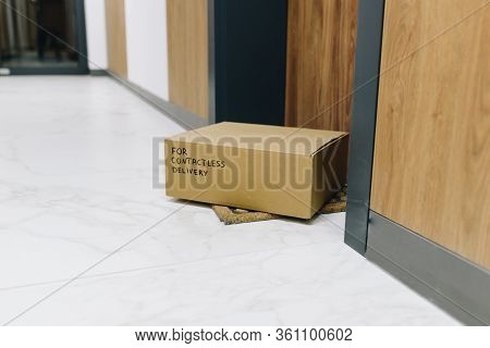 Contactless Delivery Box On Doormat Next To Front Door, Package Ordered Online During Global Coronav