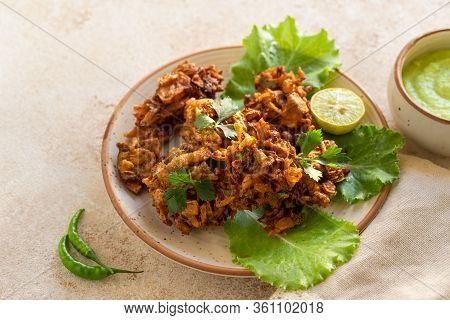 Indian Cuisine Indian Food. Pakora Traditional Indian Deep-fried Snack. Pakoras On Black Plate With 