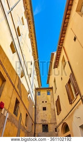 Angle shot of buildings in blind alley, Faenza, Italy