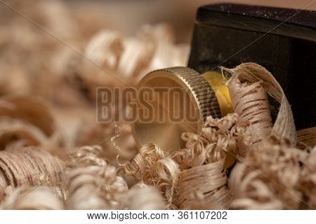 Small Block Plane With Wood Shavings On The Workbench