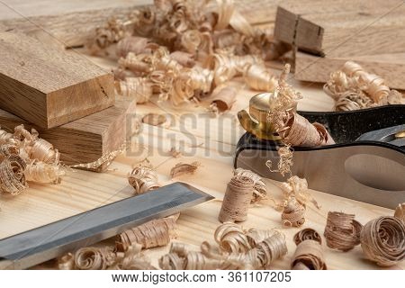 Chisel And Small Block Plane With Wood Shavings