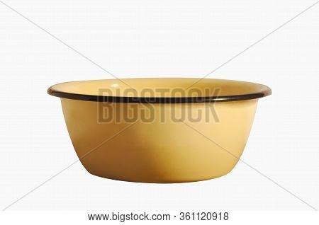 Enameled Bowl Of Yellow Color Isolated On A White Background.