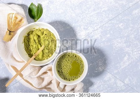 Matcha Green Tea Cup, Matcha Green Tea Powder Bowl, Wooden Spoon, Bamboo Whisk, Fresh Leaves On Napk
