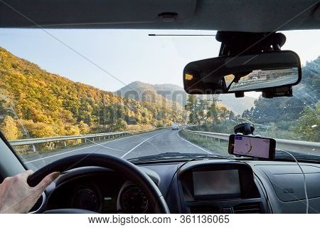 Tbilisi, Georgia - October 22, 2019: Car Vindow, Hand Of Woman On Steering Wheel And View To The Roa