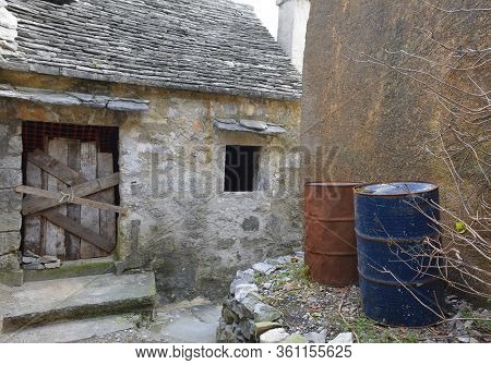 An Old Wooden Door In A Derelict Building In The Historic Hill Village Of Stanjel In The Komen Munic
