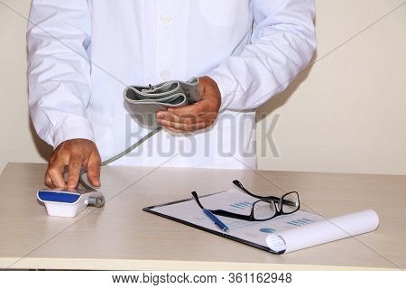 Close-up - Doctor Measures Blood Pressure