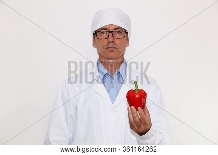 The Doctor Is Holding Vegetables And Fruits For Proper Wholesome Nutrition