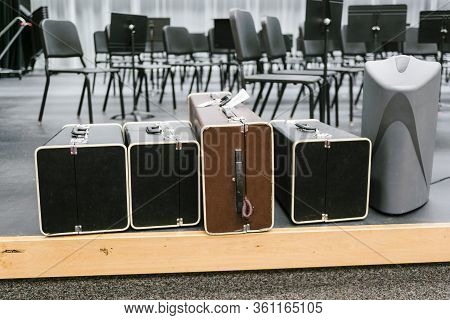 Four Musical Instruments In Their Cases Waiting To Be Disbursed