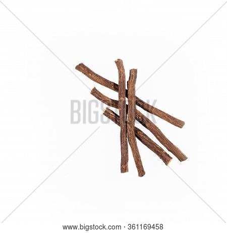 Close Up Of Ayurvedic Herb Liquorice Root,licorice Root, Mulethi Or Glycyrrhiza Glabra Root On A Woo