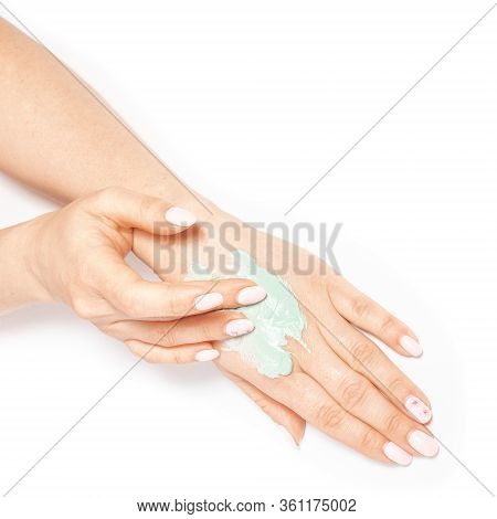View From Above Woman's Hands Apply Homemade Skin Care Mask. Clay Mask