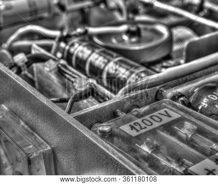 Inside View Of High Frequency Power Amplifier With Capacitors, Coils And Other Components In Black A