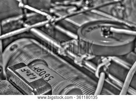 Inside View Of High Frequency Power Amplifier With Capacitors, Coils And Other Components In Black A