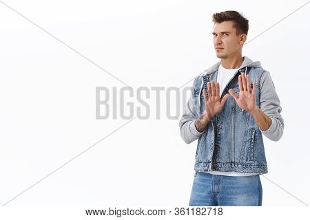 No Thank You. Portrait Of Restrained And Disgusted Young Blond Guy Cringing, Show Stop Sign Or Taboo