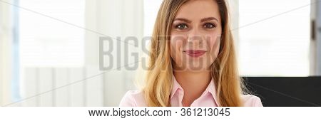 Portrait Of Smiling Businesswoman Posing With Crossed Arms In Company Office. Good-looking Employee 