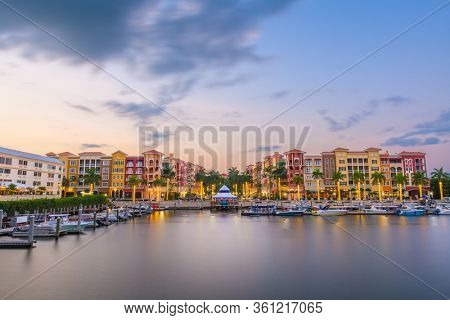 Naples, Florida, USA downtown cityscape on the bay at dusk.