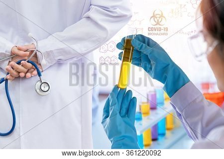 Doctor And Microbiologist With Vacuum Tubes For Samples With Covid 19 Infection Atypical Pneumonia V