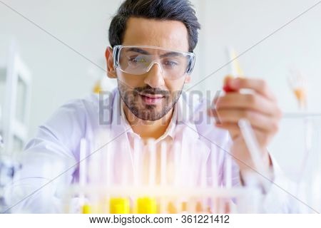 Doctor And Microbiologist With Vacuum Tubes For Samples With Covid 19 Infection Atypical Pneumonia V