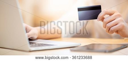Male Customer Hand Using Credit Card For Online Shopping During Quarantine At Home. Male Shopper Buy