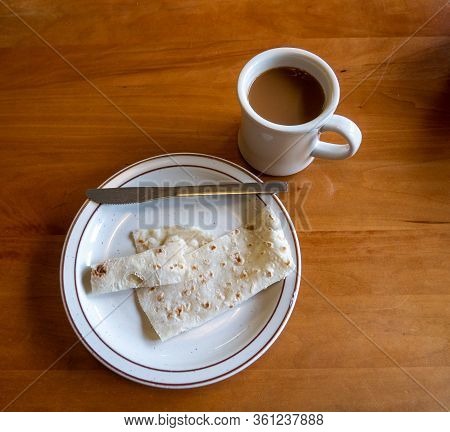Top Down View Of Plate Of Traditional Scandinavian Lefse On Wooden Table
