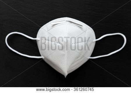 Facial Medical Maska For Virus Protection On A Black Textured Background