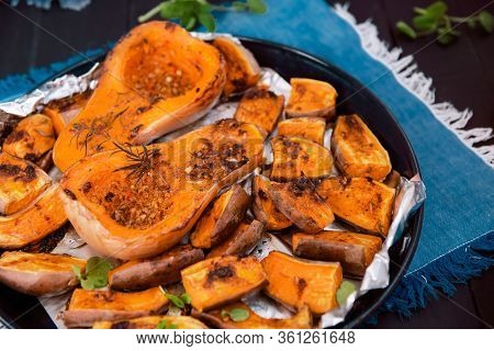 Close Up Baked Roasted Grilled Whole Orange Pumpkin Butternut Squash And Sweet Potato Slides With He