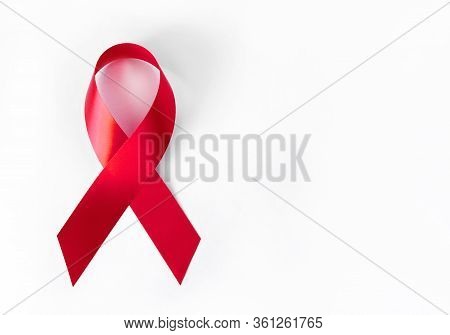 Red Symbolic Ribbon - The Problem Of Aids, Vasculitis, Anorexia, Drug Abuse. On A White Background