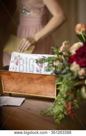 Wedding Card Announcements In A Decorative Bin At The Entrance Of A Wedding Ceremony Hallway Decorat